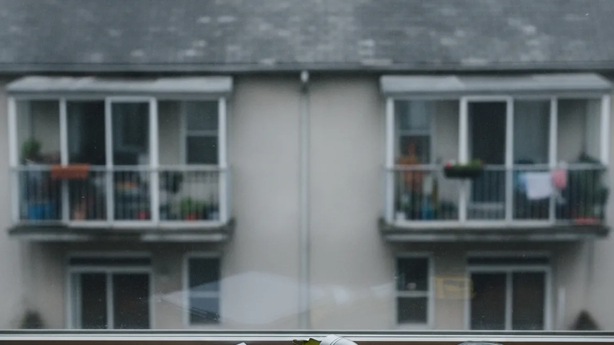 Inspector examining the roof and structure of a residential building during major work assessment in Quebec